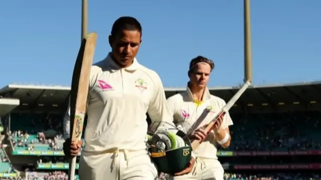 Usman Khawaja (left)