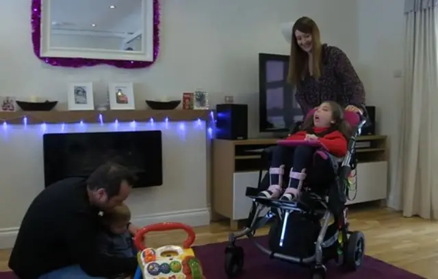 Wheelchair user Lois and her family