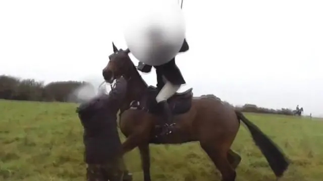 Horserider beats man during a hunt in East Sussex