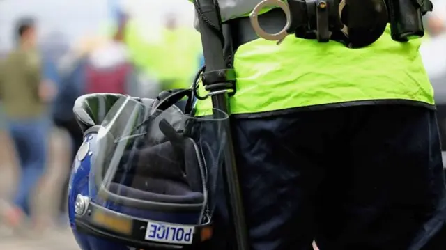 Police baton and helmet