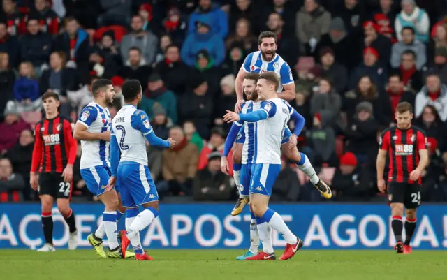 Wigan celebrate going two up against Bournemouth