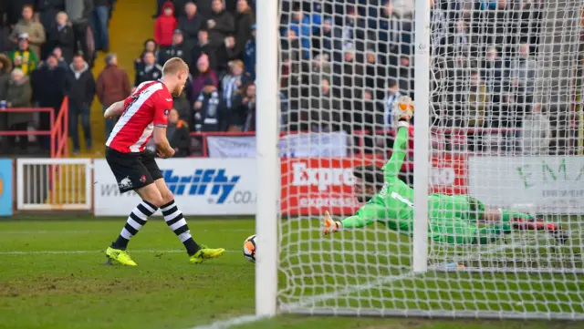 Jayden Stockley of Exeter City misses a chance against West Brom