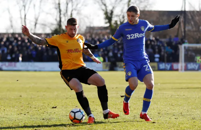 Newport's Bennett holds the ball up against Leeds