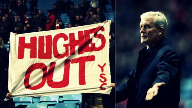 A Hughes Out banner and Mark Hughes