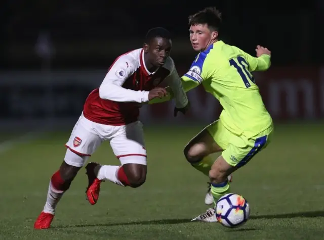 Jordi Osei Tutu of Arsenal takes the ball past Charles Vernam of Derby