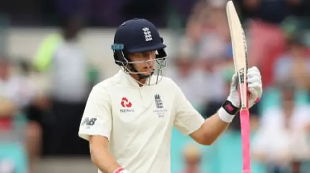 Joe Root celebrates 50