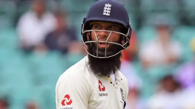 Moeen Ali walks off after being dismissed by Australia's spinner Nathan Lyon