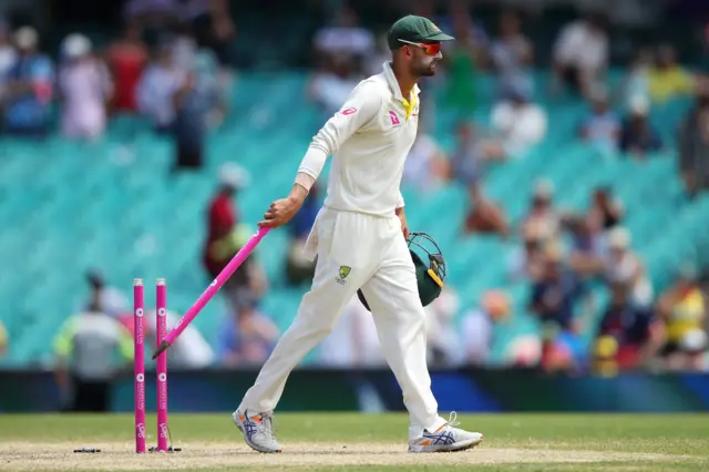 Nathan Lyon takes a stump as a souvenir at the end of play