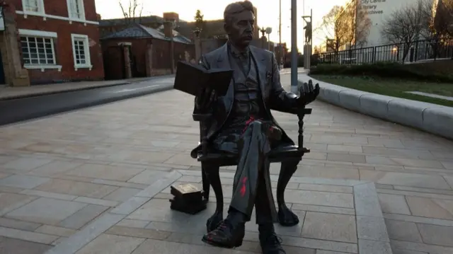 The Arnold Bennett statue with red paint on it