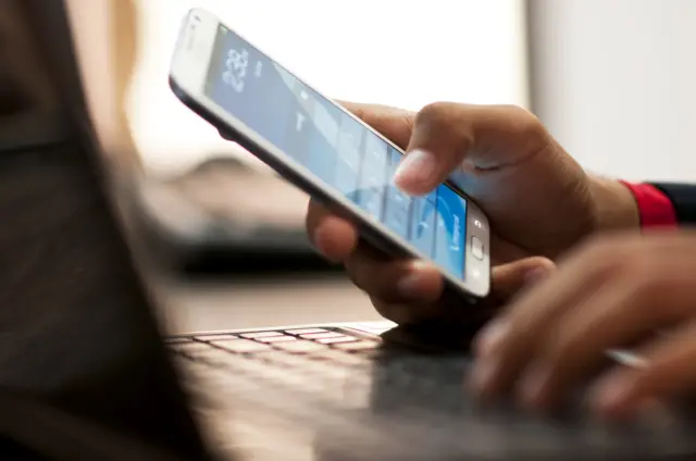 A woman using a mobile phone