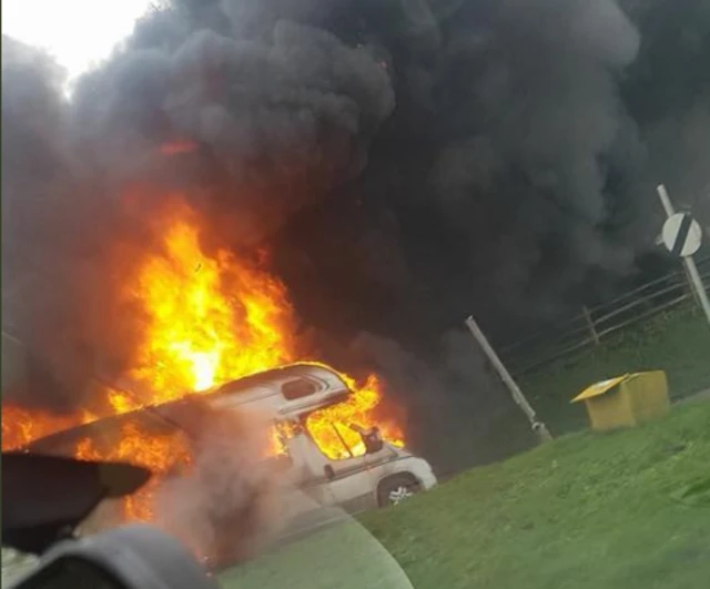 burning campervan