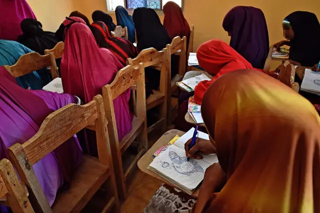 Young women take part in an art lesson at the Elman Peace and Human Rights Centre in Mogadishu on March 24, 2015, where survivors of sexual violence can find refuge, medical care and support. Sexual violence is widespread in Somalia and rarely prosecuted.