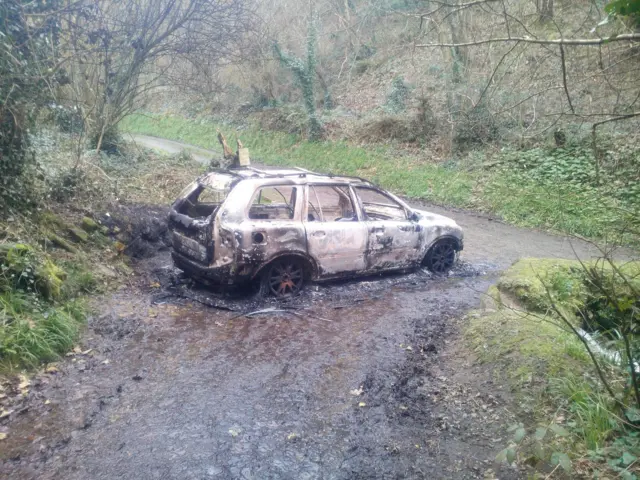 A burnt out car at Petit Bot