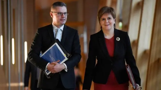 Derek Mackay arrived in the Holyrood chamber alongside First Minister Nicola Sturgeon ahead of his budget speech