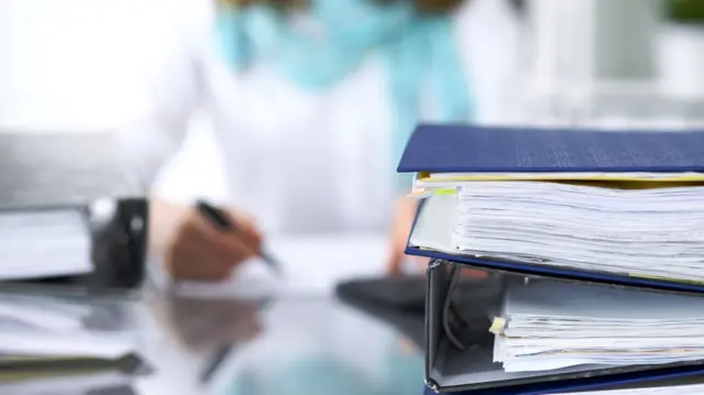 A woman working with files