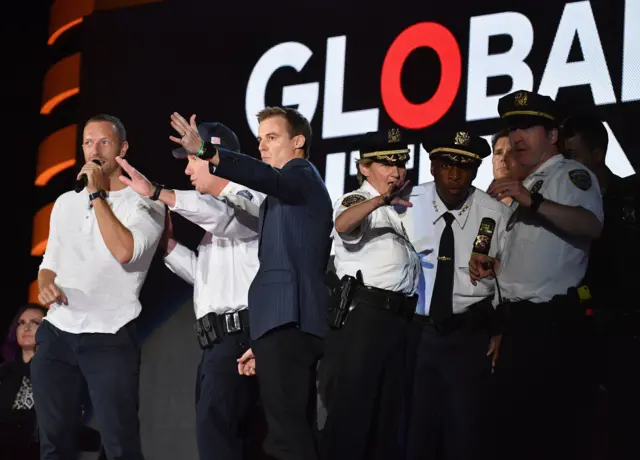 Chris Martin and security looked concerned at Global Citizen