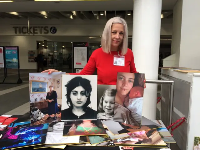 Artist Helen Marshall with some of the photos