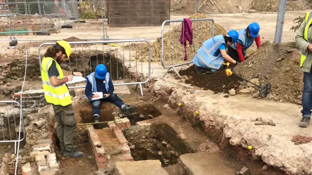 People in a trench