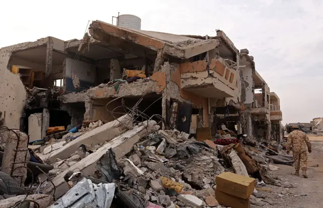 A picture taken on November 10, 2011 shows heavily damaged apartment buildings in a residential campound reportedly hit by NATO airstrikes last month in the war-battered city of Sirte