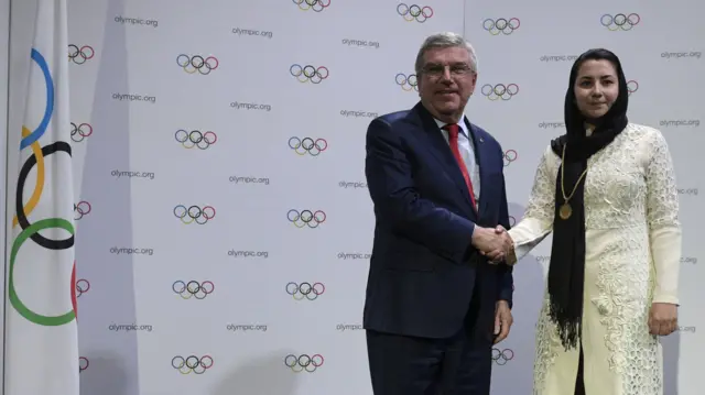 IOC President Thomas Bach (left) and Samira Asghari