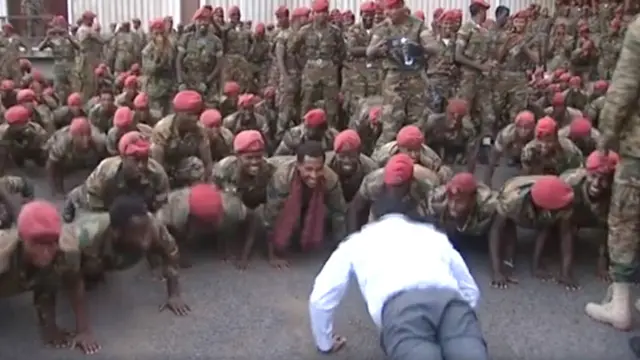 Abiy Ahmed doing press-ups with the soldiers