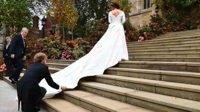 Princess Eugenie arrives accompanied by her father Prince Andrew, Duke of York, at St George"s Chapel for her wedding to Jack Brooksbank in Windsor Castle