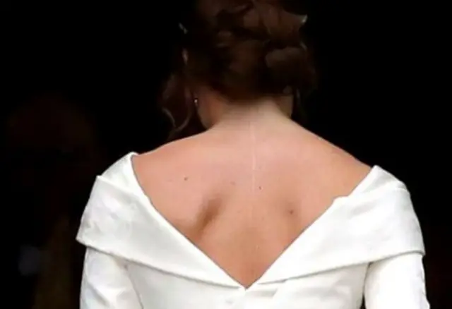 Princess Eugenie shown in her wedding dress from the back