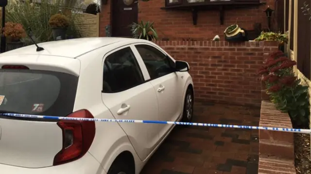 Police tape outside house