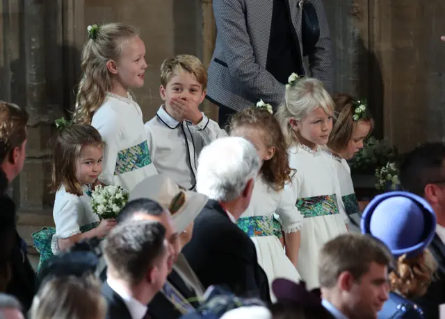 Prince George covering his mouth in the chapel