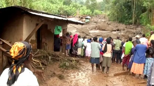 People look at devastation caused