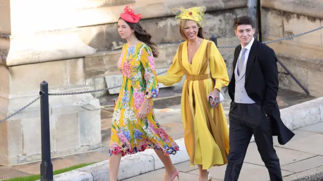 Heather Kerzner (centre) arrives for the wedding of Princess Eugenie