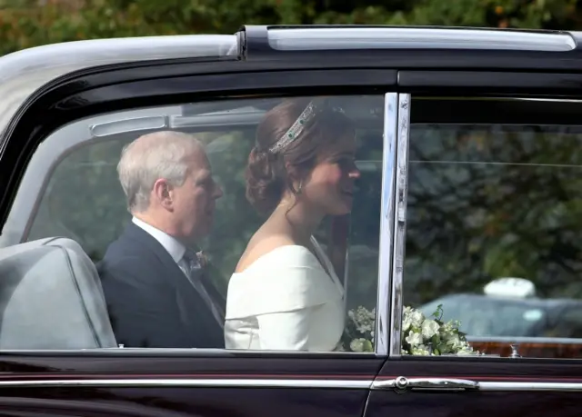 Princess Eugenie is driven towards St George's Chapel with her father Prince Andrew, Duke of York