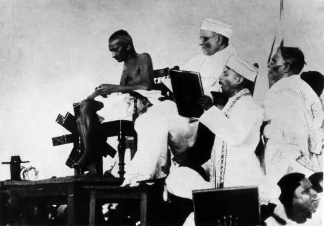 The Mahatma Gandhi spinning wool by a spinning wheel during a speech in Madras, present Chennai. Madras, 1925