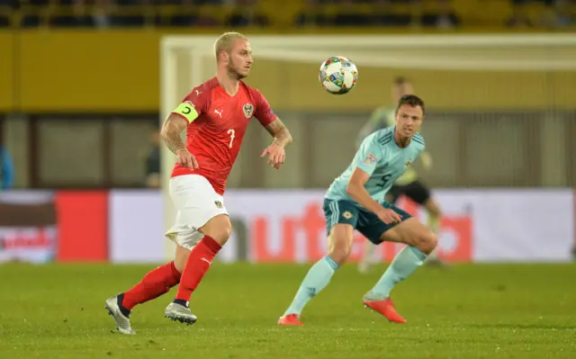 Marko Arnautovic gets the ball under control as Northern Ireland defender Jonny Evans watches on. The game hasn't been a great watch so far, though.