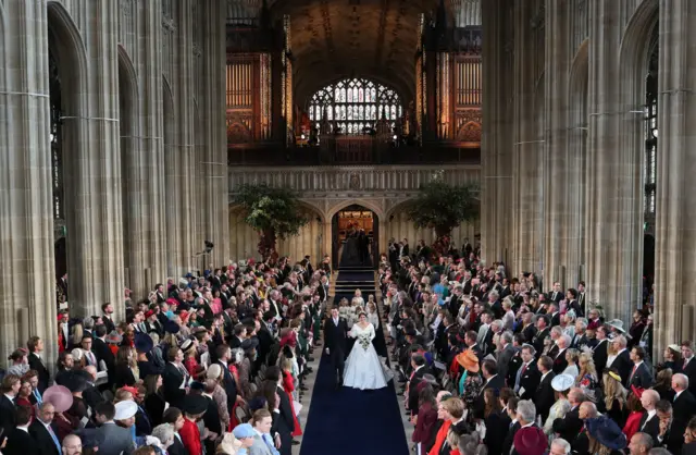 Jack Brooksbank and Princess Eugenie walking down the aisle