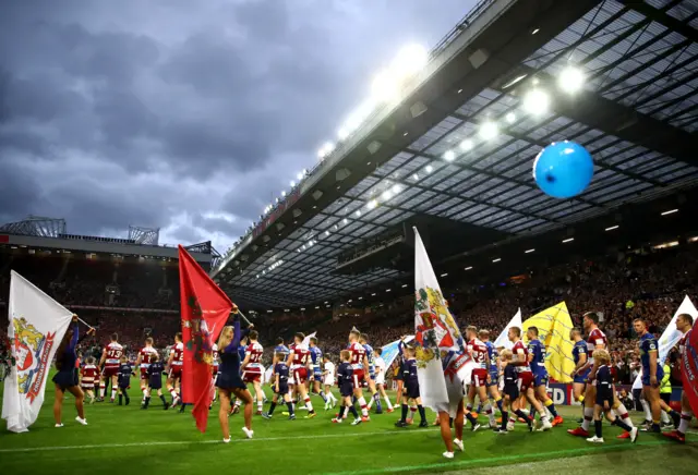 Wigan Warriers and Warrington Wolves walk out