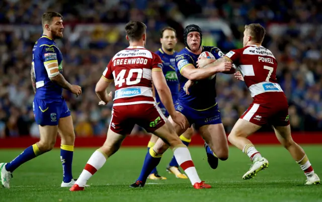 Warrington's Chris Hill takes on Wigan's defence