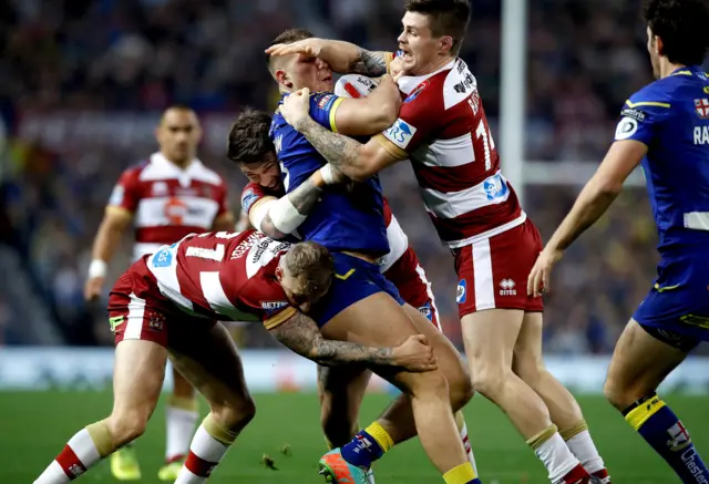 John Bateman gets a tackle on Tom Lineham