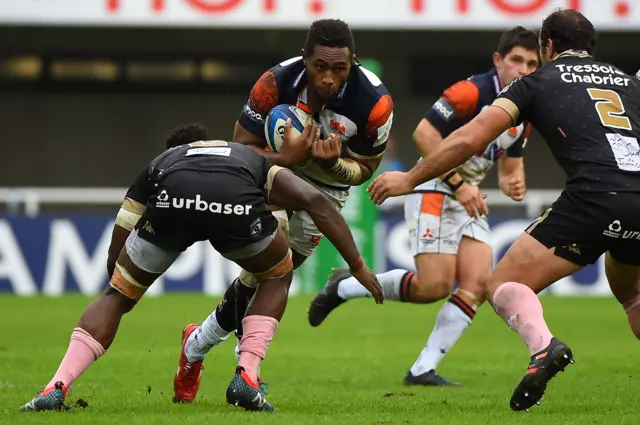 Edinburgh's Viliame Mata (C) runs with the ball during the European Rugby Champions Cup match at Montpellier