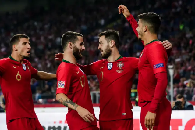 Portugal celebrate a goal Bernardo Silva (second right) against Poland