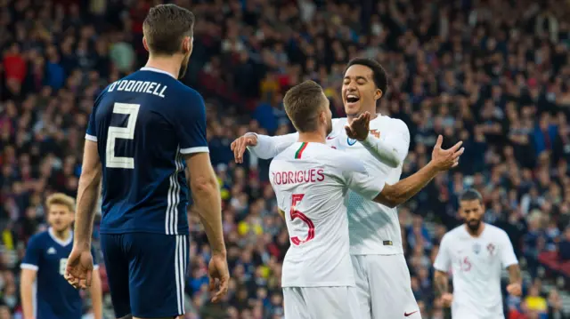 Portugal's Sergio Oliveira and Helder Costa celebrate