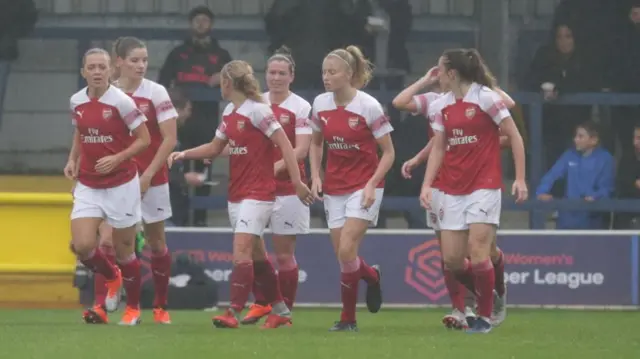 Arsenal celebrate a goal against Chelsea