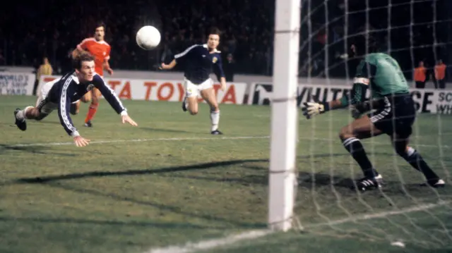 Kenny Dalglish heads towards goal for Scotland against Portugal in 1980