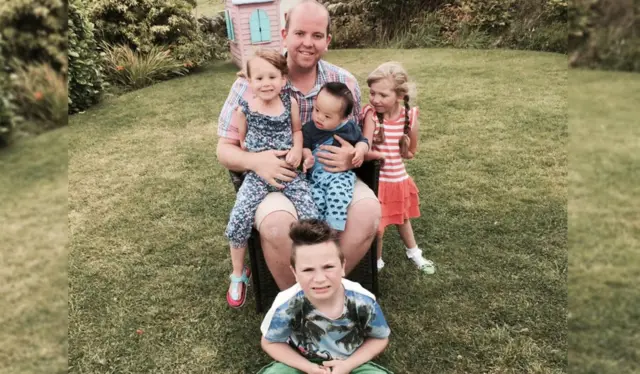 Ben Carpenter with his four children