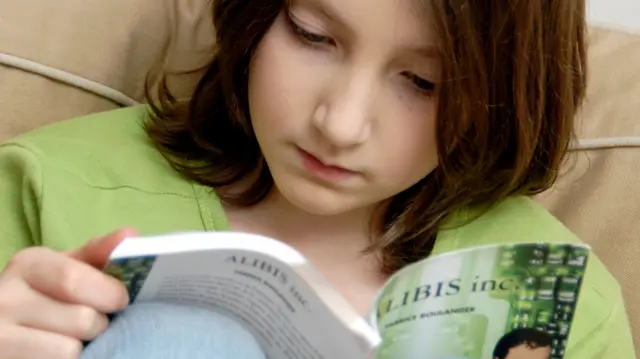 Child reading a book