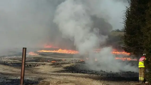 Smoke and flames at the site