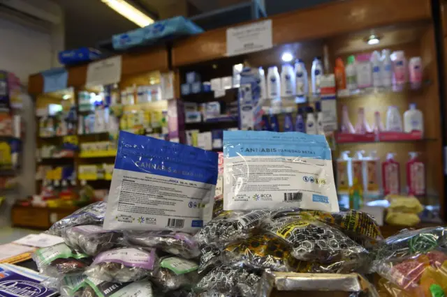 Envelopes containing marijuana are on display at a pharmacy in Montevideo