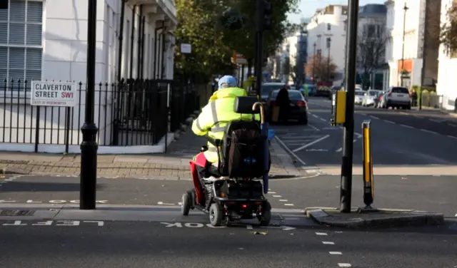 A person using a mobility scooter in London