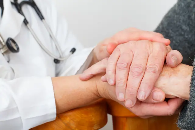 Doctor holding hand