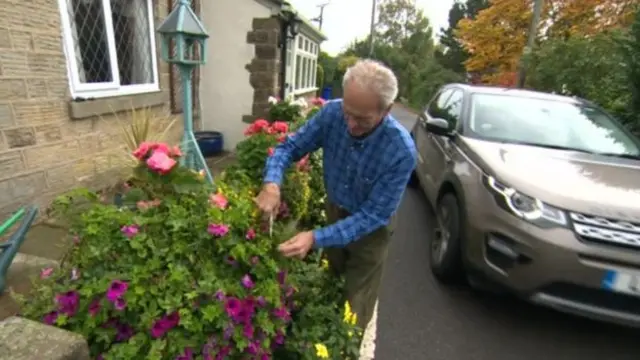 A man cuts the flowers